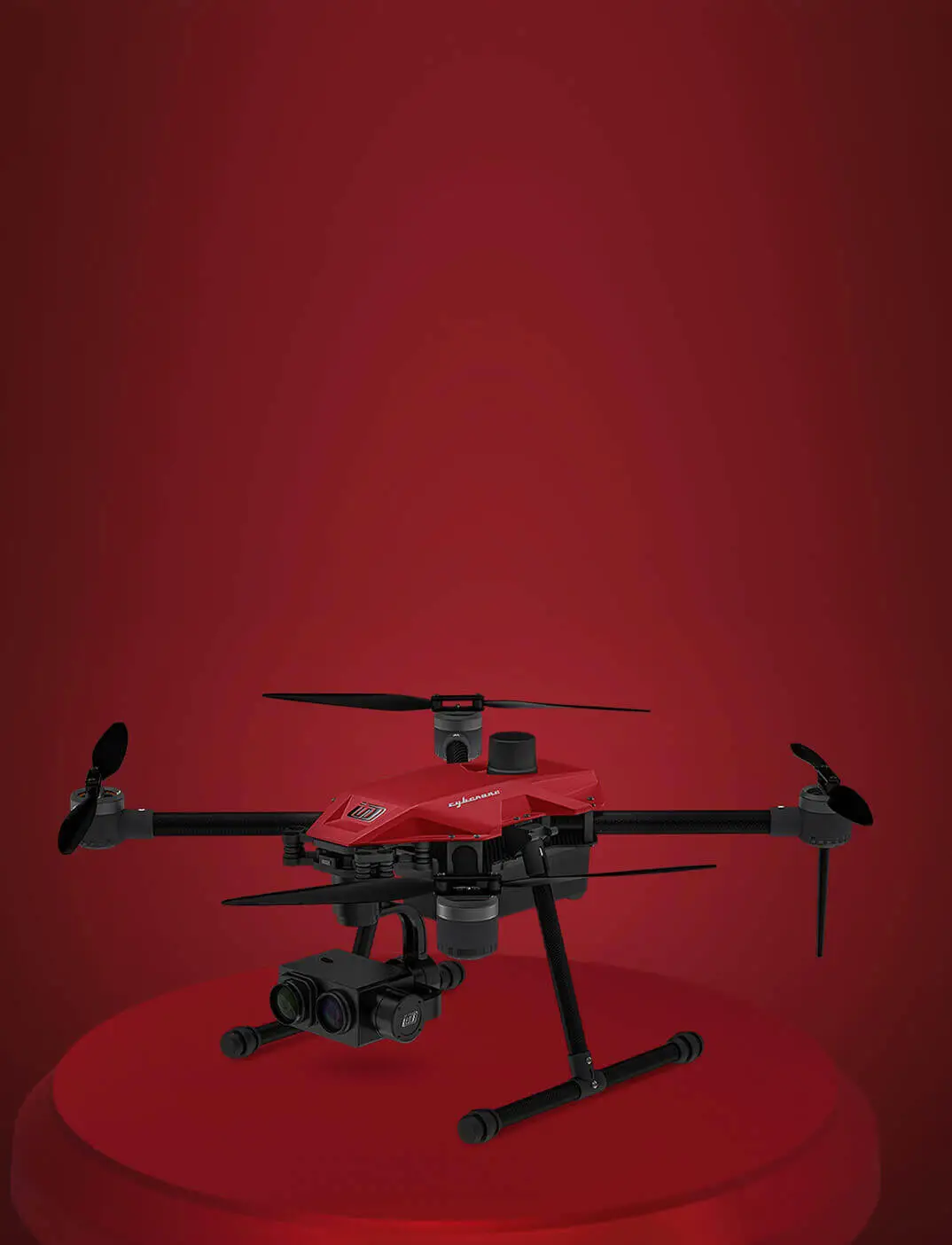 Jet black coloured drone is on rock with white
                  mountain in background with clouds