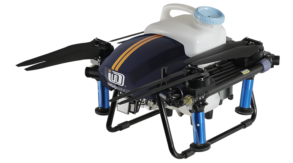 Green crops with sky view with e-series of agricultural drone is spraying water onto the crops.